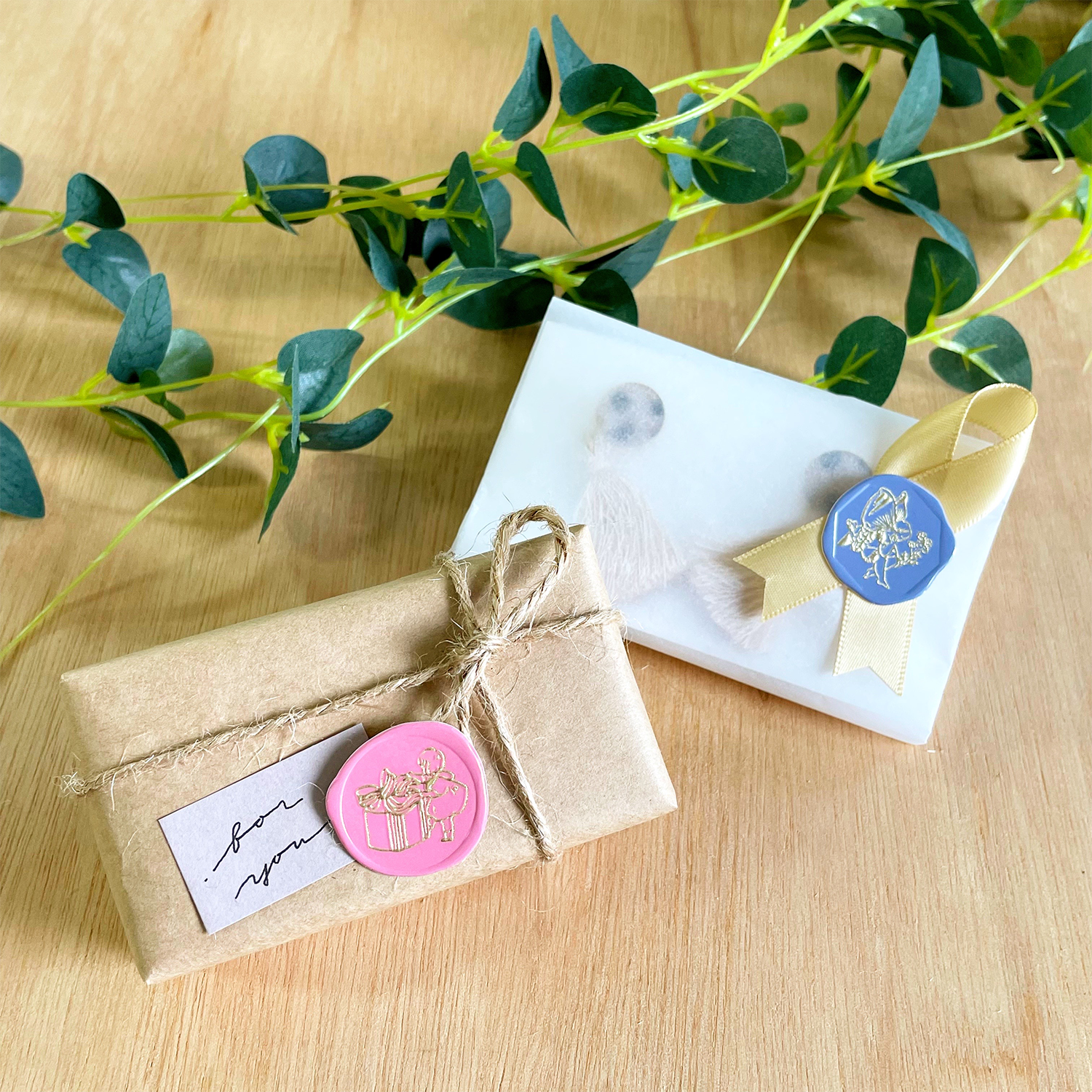 Small packages decorated with ribbon and sticker.