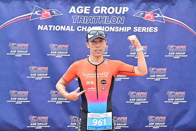 An athlete wearing triathlon wear with Artline, Shachihata logo 