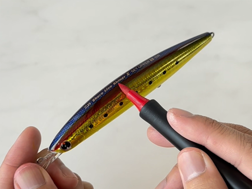 adding red line onto blue & yellow fishing lure