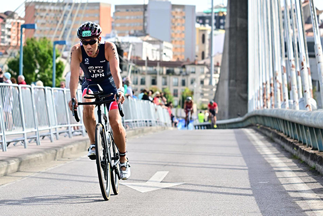 A man is riding on a bike