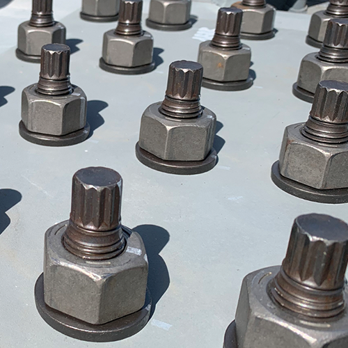 Multiple high-strength bolts with markings.