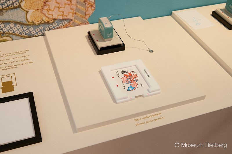 Introduction to Surimono, a vibrant form of Japanese woodblock print, and an interactive Ukiyo-e Layer Stamp display at the Museum Rietberg.