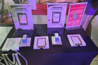A booth featuring layered stamps of kabuki kumadori makeup.