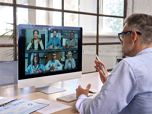 A business person having online meeting with Artline200 RICH BLACK in his hand