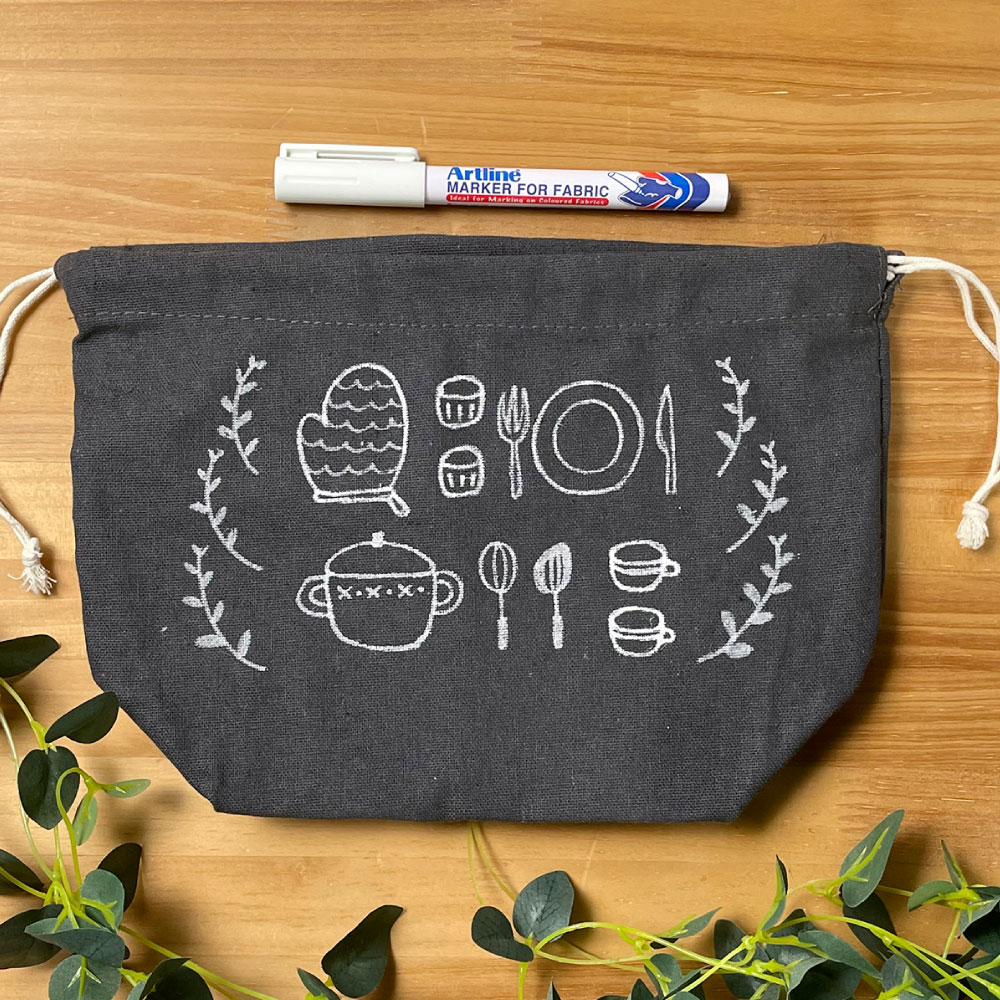 a pouch with illustration drawn with Artline MARKER FOR FABRIC